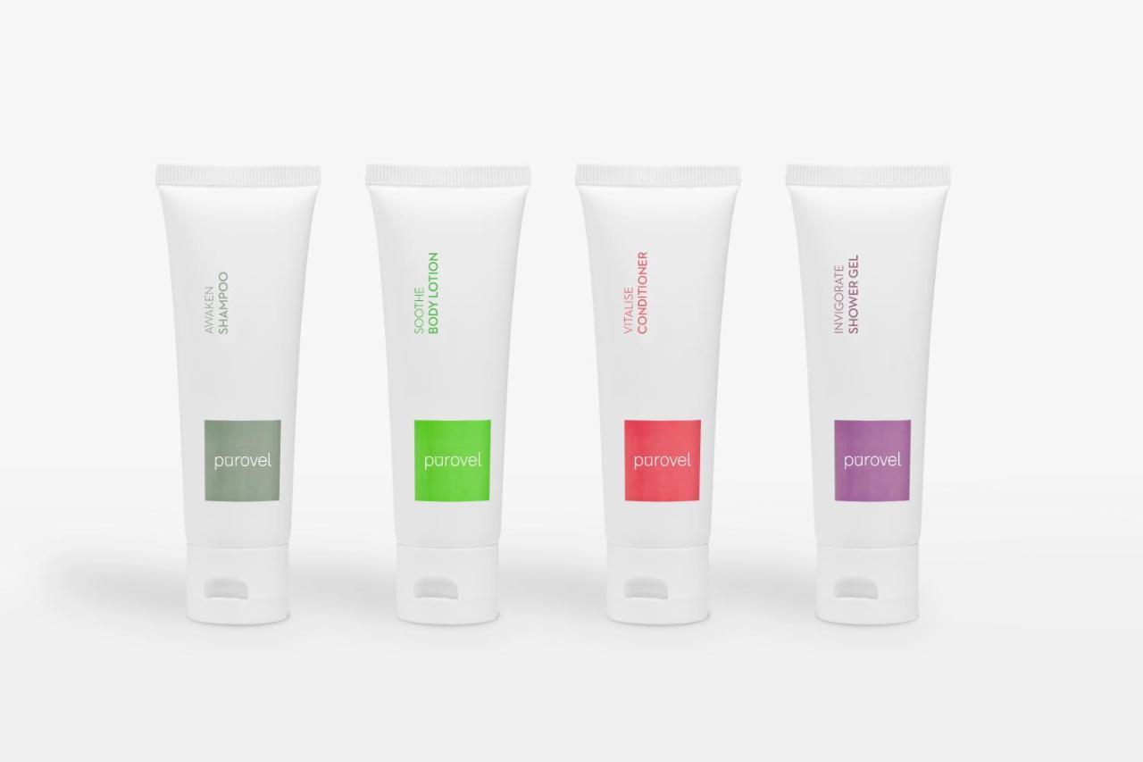 Paradox Singapore Merchant Court At Clarke Quay Экстерьер фото The photo shows four tubes of cream or lotion, each with a distinct color label. The tubes are all white with a flip-top cap at the bottom. From left to right, the first tube has a green label, the second a darker green, the third a red label, and th